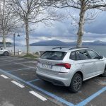 A rental car in Italy in a car parking just behind lake Garda