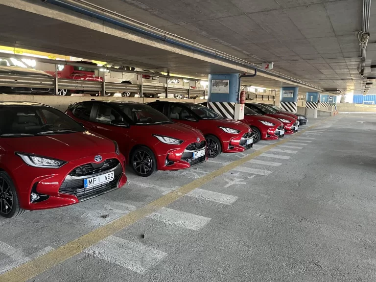 A fleet of Toyota Yaris cars ready for car rental pick-up