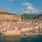 Cefalu old town rising from the sea, a classic day trip after car rental at Palermo Airport