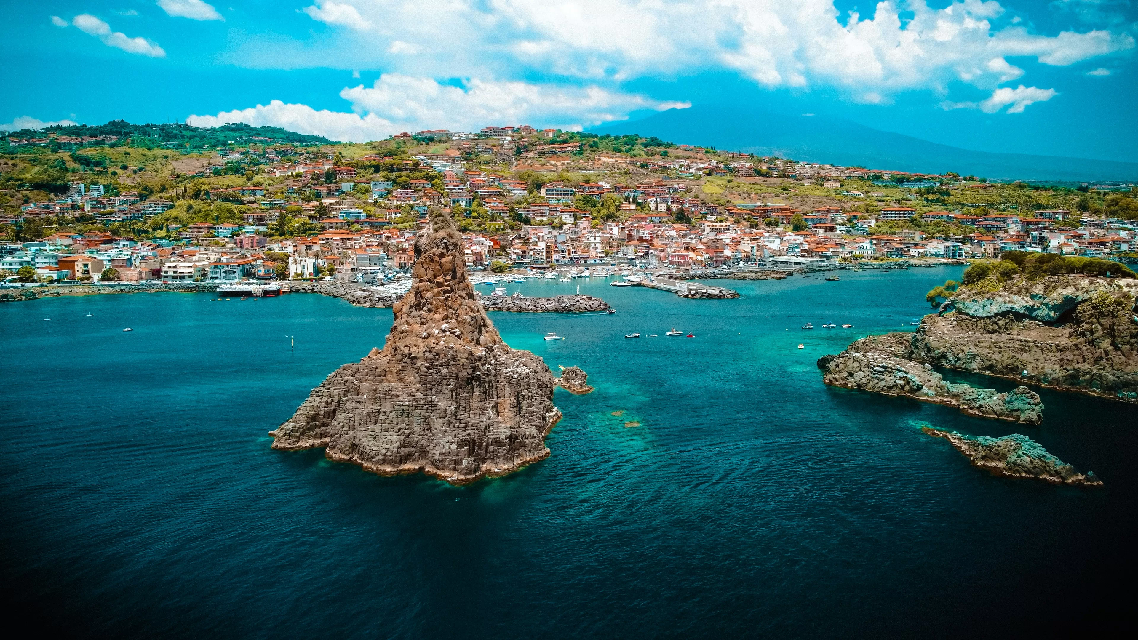 Historic Sicilian old town on a small island by the sea, a day trip after car rental at Catania Airport