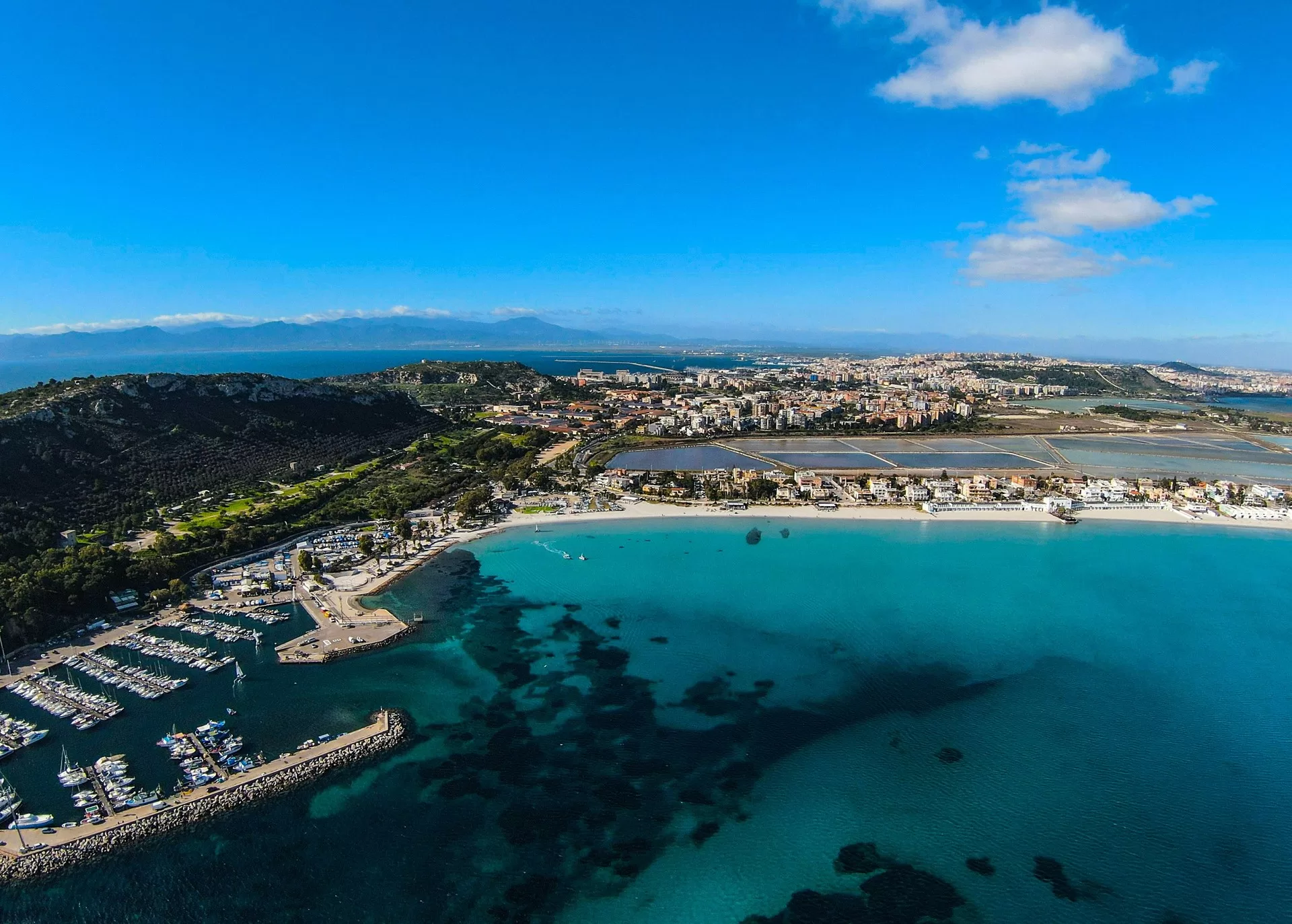 Aerial view of the marina and Poetto beach near Cagliari, about 15 minutes by car from Cagliari Airport