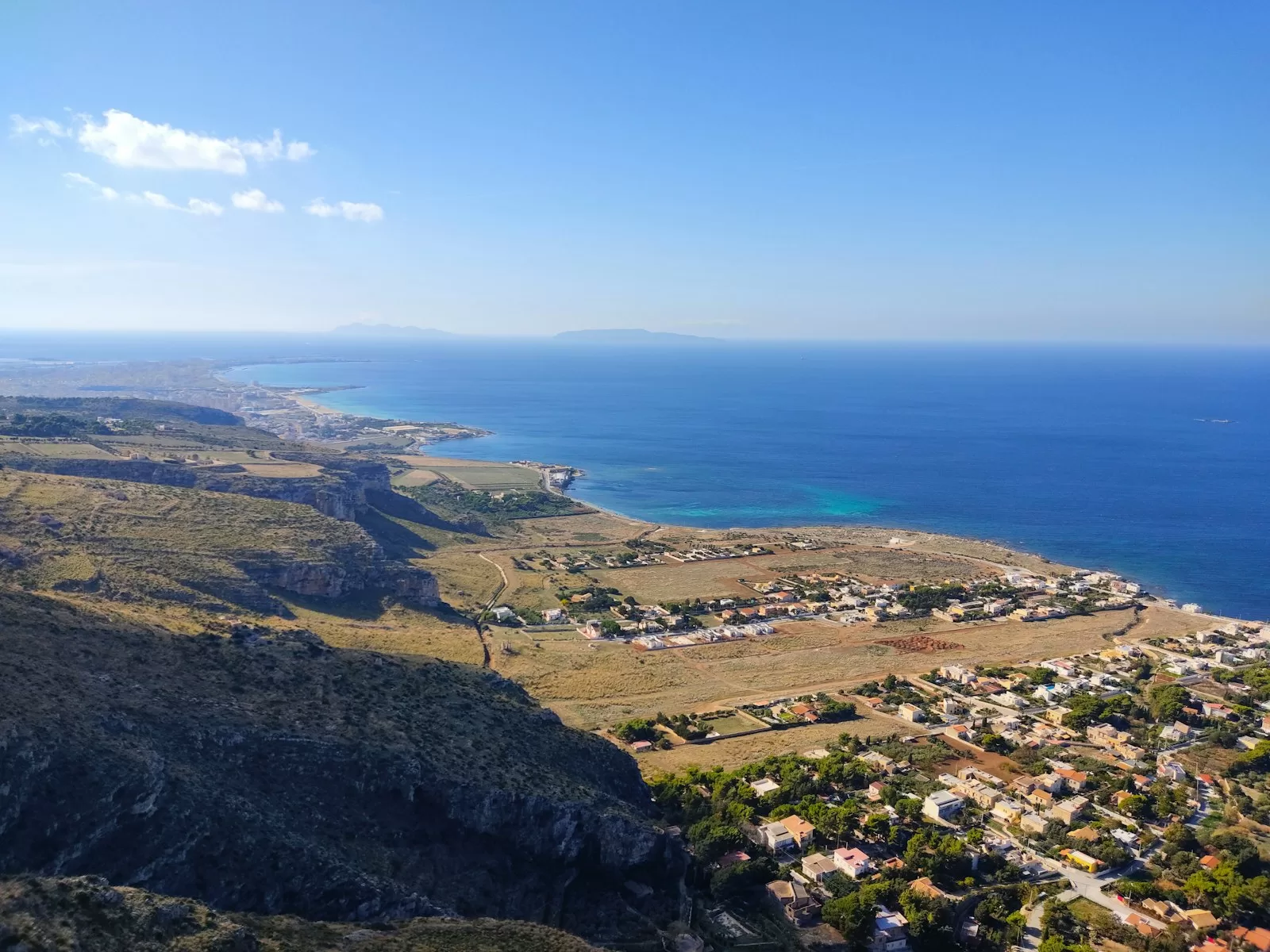 Aerial view of the coast at Pizzolungo near Erice with the Egadi islands, a short drive after car rental at Trapani Airport