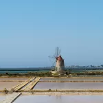 Car rental at Trapani Airport: windmill at the Saline di Trapani salt pans, the landmark of western Sicily
