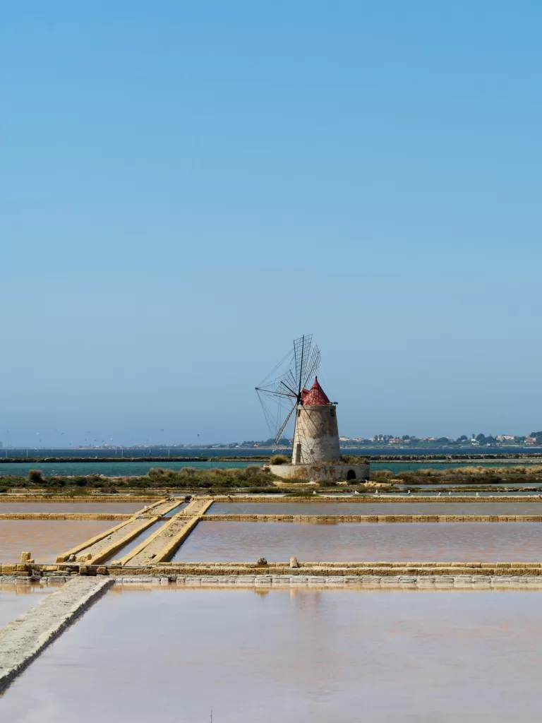 Car rental at Trapani Airport: windmill at the Saline di Trapani salt pans, the landmark of western Sicily