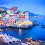 Pastel houses and fishing boats in Boccadasse, Genoa, about 21 minutes by car from Genoa Airport