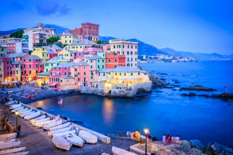 Pastel houses and fishing boats in Boccadasse, Genoa, about 21 minutes by car from Genoa Airport