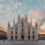 Milan Cathedral on Piazza del Duomo at sunrise, about 18 minutes by car from Milan Linate Airport in light evening traffic