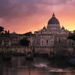 St Peter's Basilica above the Tiber in central Rome, which is about 34 minutes by car from Rome Fiumicino Airport