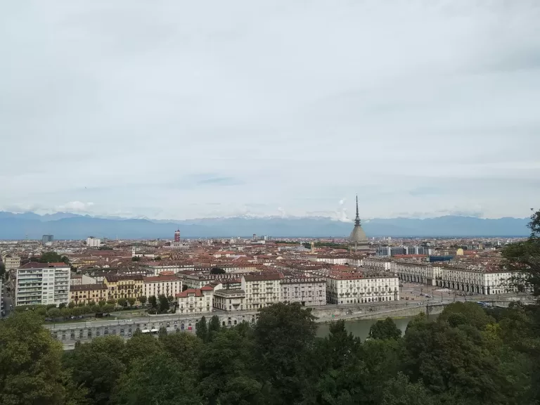 The Mole Antonelliana and the Alps above central Turin, which is about 28 minutes by car from Turin Airport